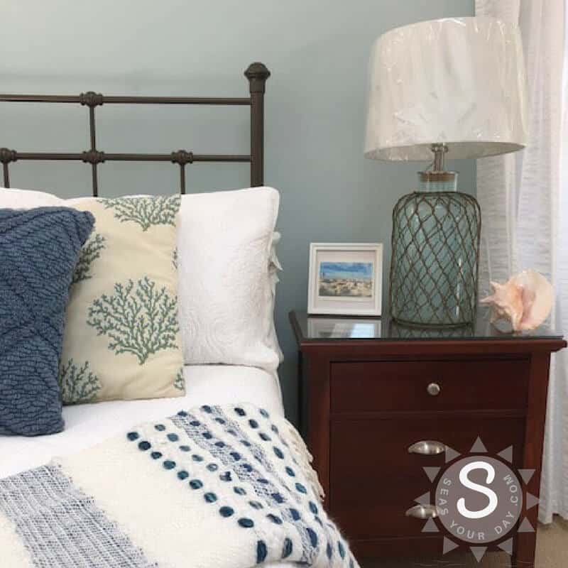 Bedroom painted with Sherwin-Williams Tradewind paint color | https://www.seasyourday.com/sherwin-williams-tradewind-paint-bedroom-color-makeover