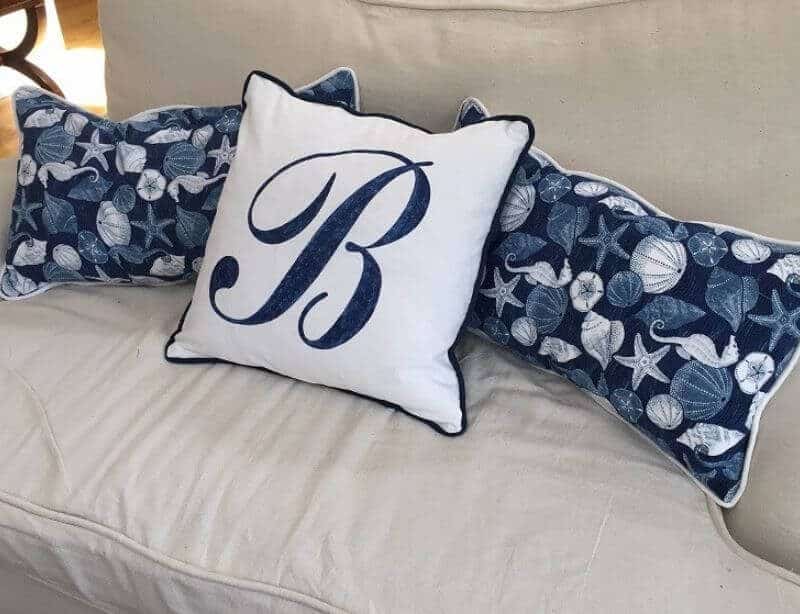 Tea Towel Pillows in blue and white seashell motif print, and blue monogram white pillow